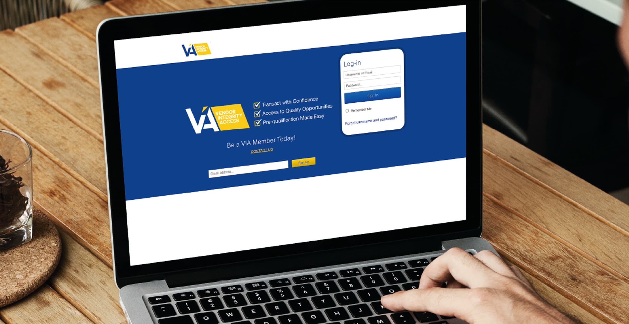 Vendor Integrity Access platform shown on a laptop.